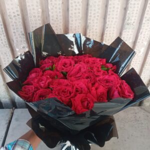 Red Rose Bouquet In Black Sheet